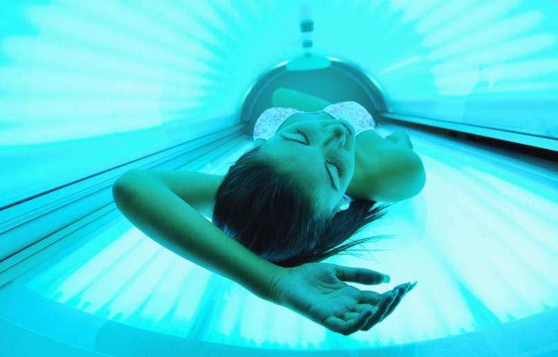 women in tanning bed